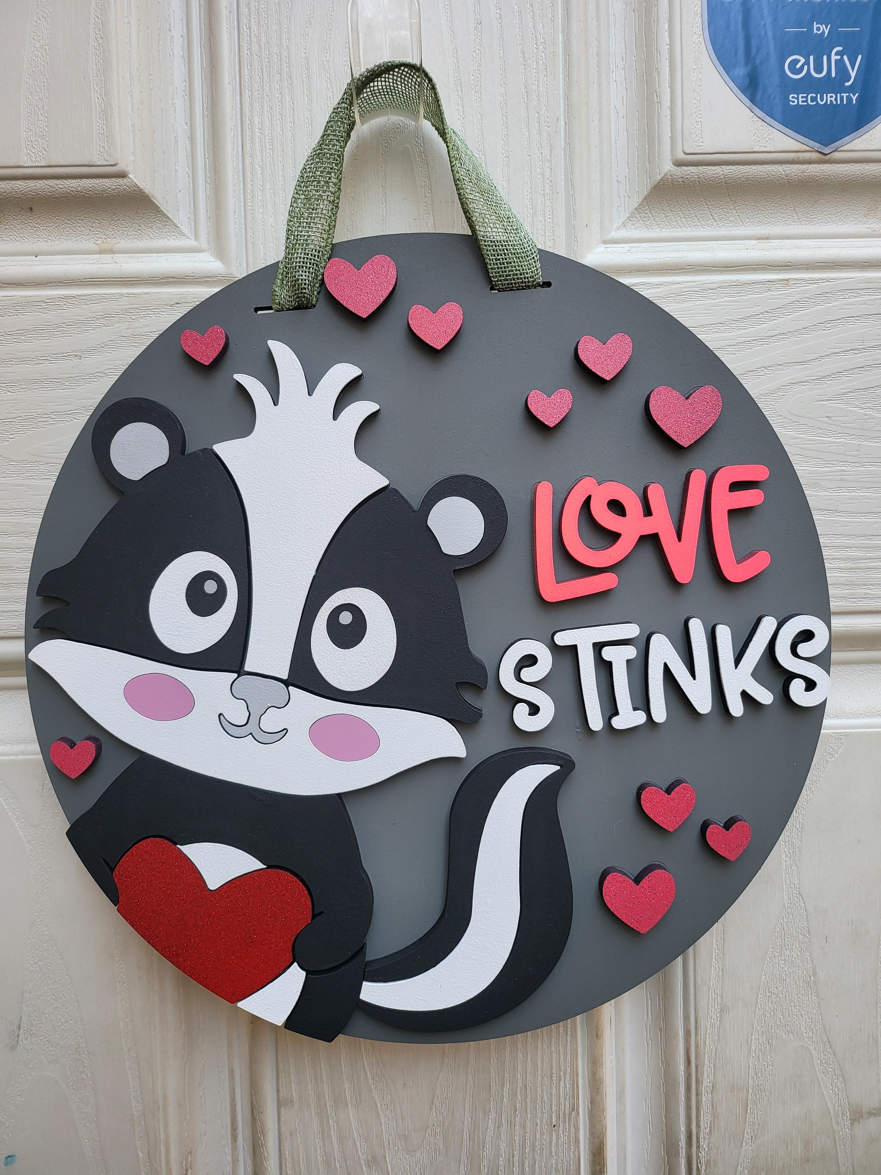 Love Stinks Door Hanger